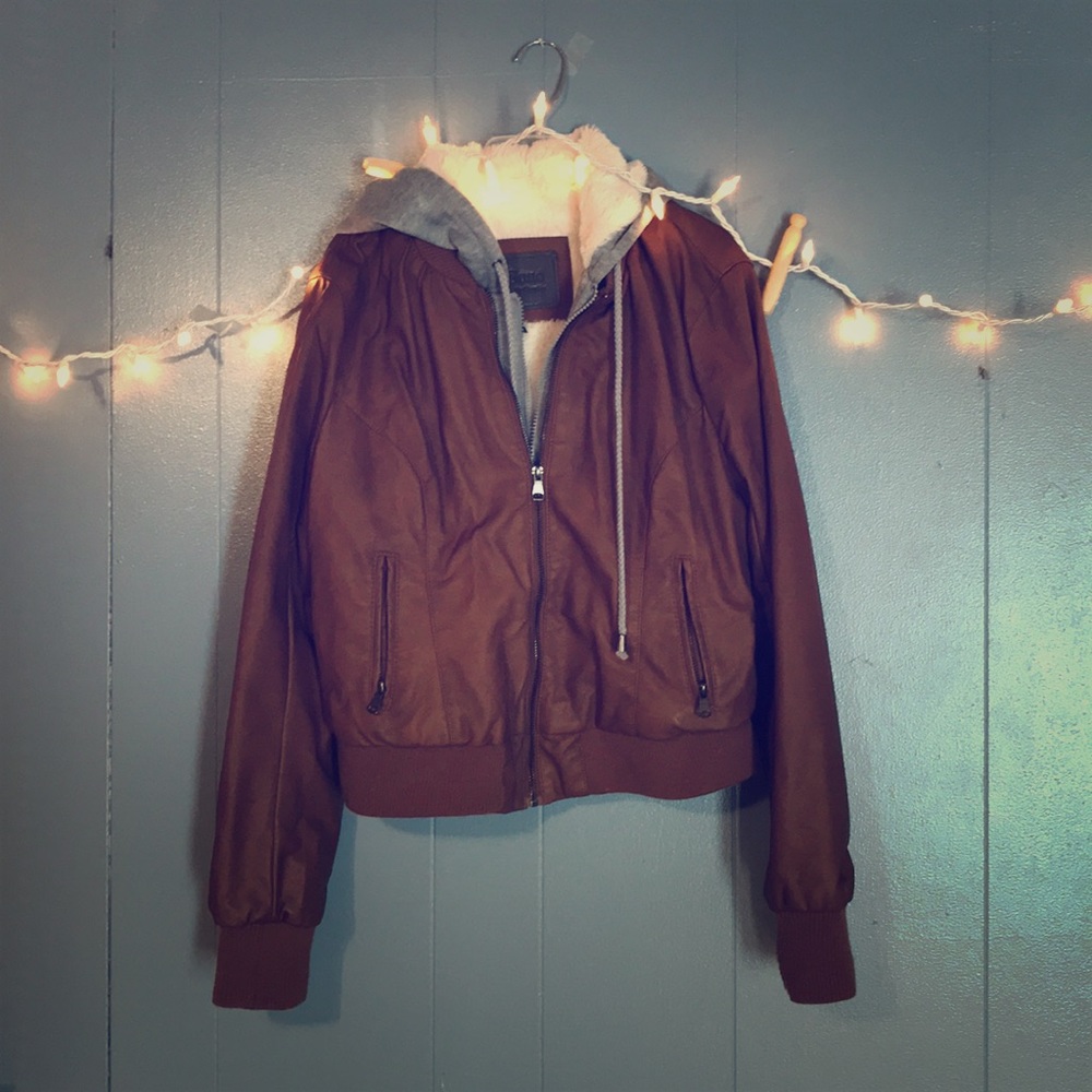 Brown leather jacket with a faux fur insert